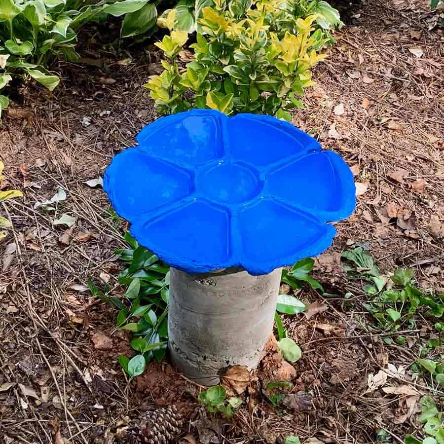 blue bird bath made with cement