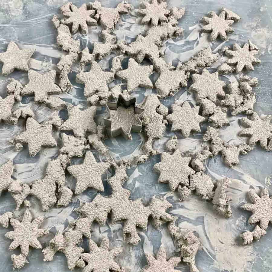 cut pieces of cement for gift tags with cookie cutter