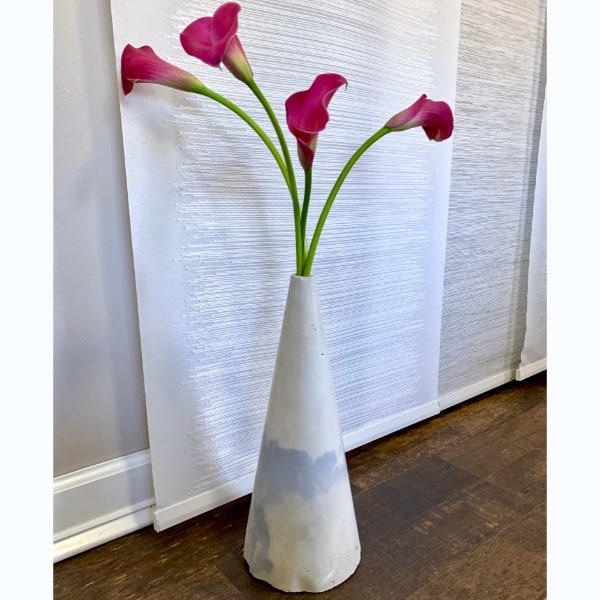 cone cement vase with flowers