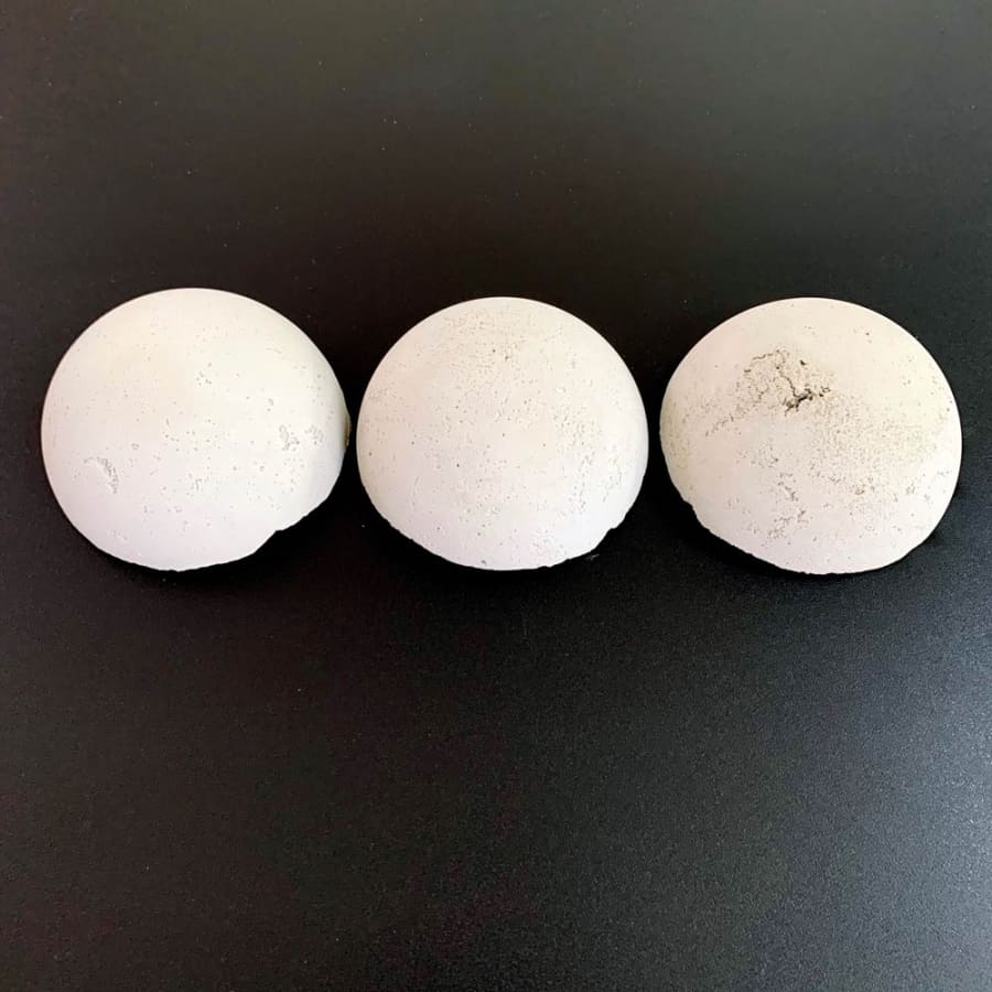 3 cement spheres tested with lubricants for demolding and how they would look on concrete crafts