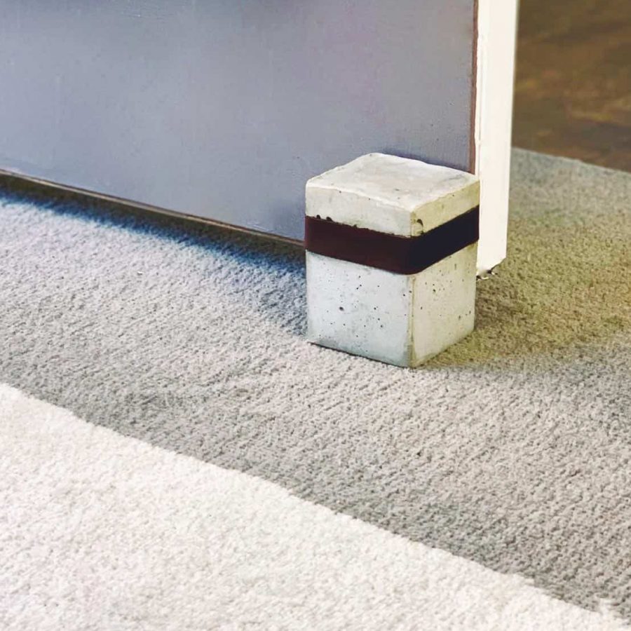 diy cement door stopper with leather wrapped around top third