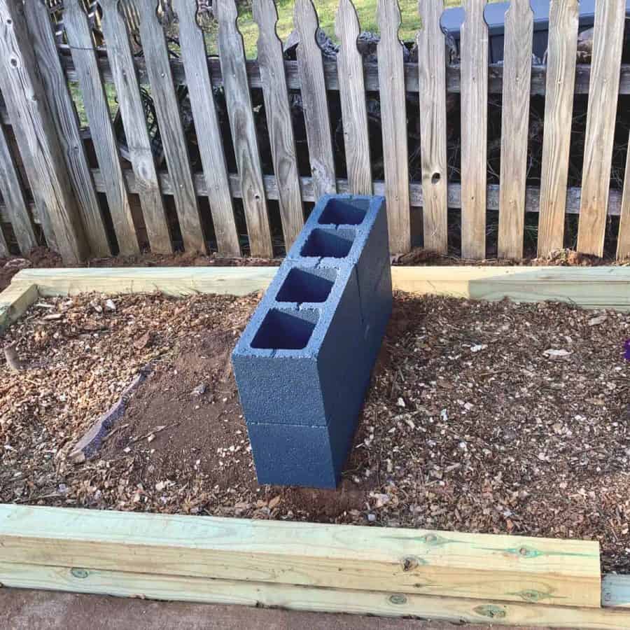 two cinder blocks stacked on top of two others with holes facing up