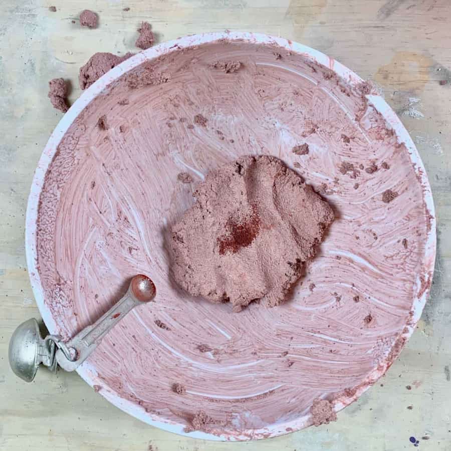 concrete crafts pigment with red powdered pigment in bowl
