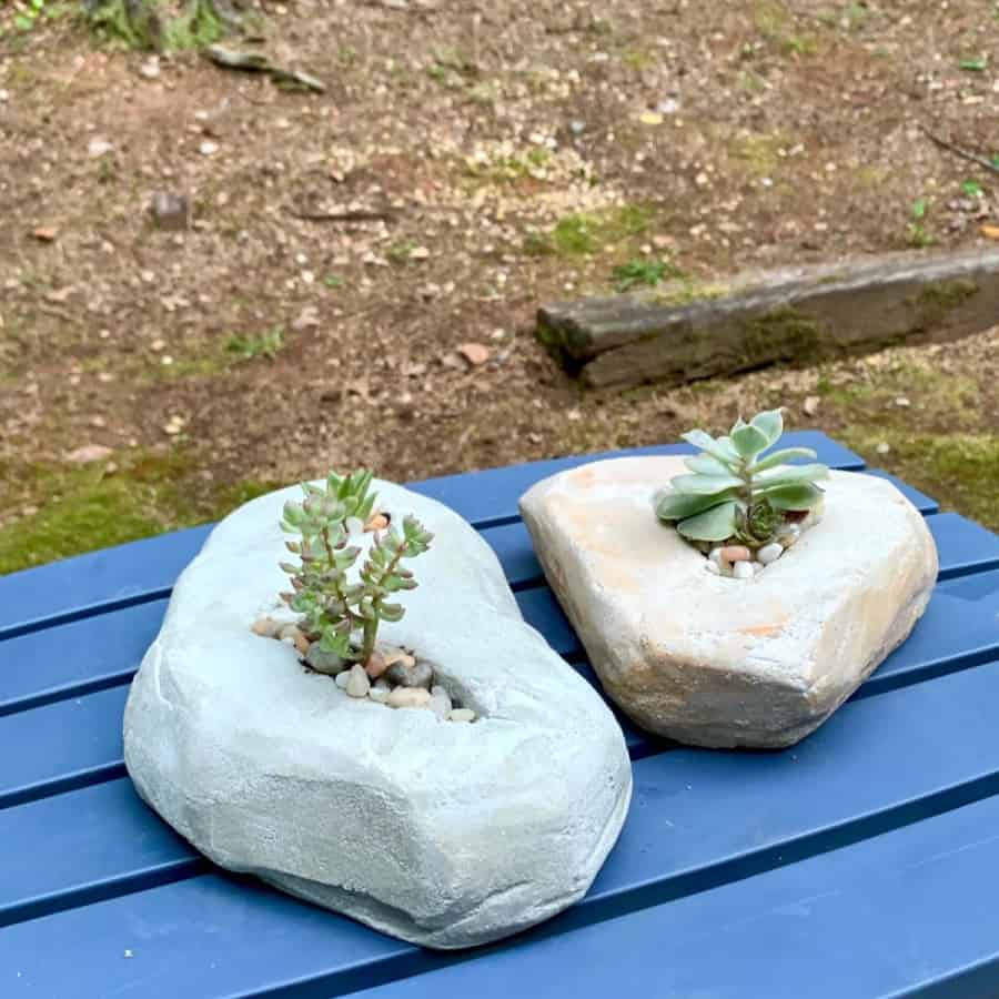 planters that look like rocks, made from cement