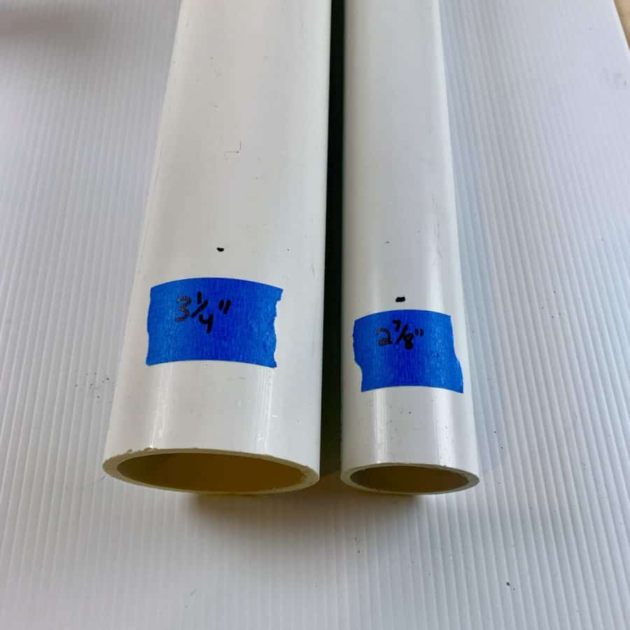 two pieces of different width pvc pipe before being cut
