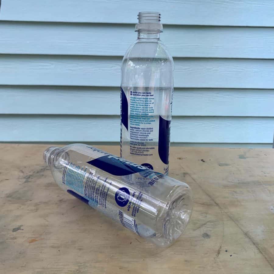 2 smart water brand bottles on a table