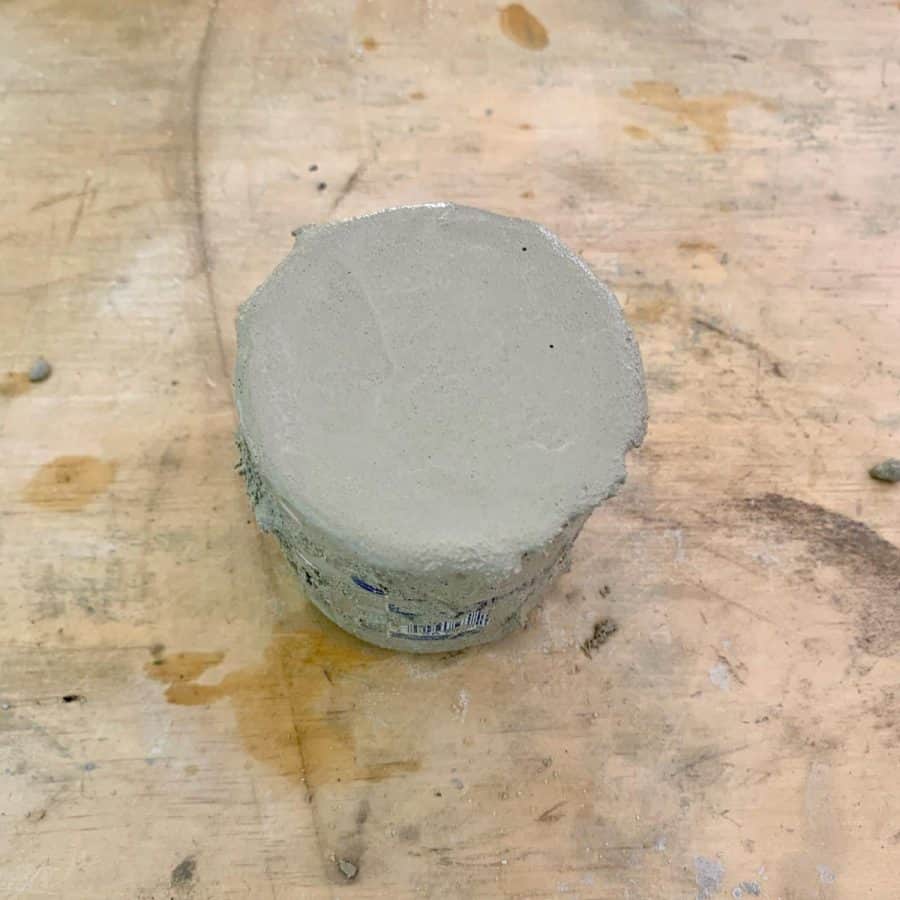 concrete filled to top of concrete holder mold for fall decor