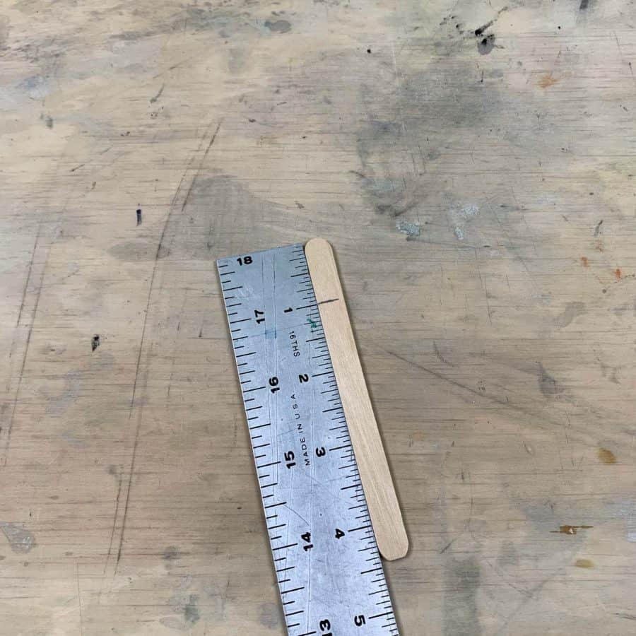 measure craft stick 1" down