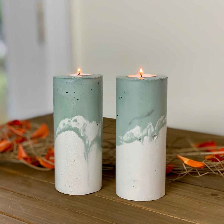 two marbled green DIY concrete pillar candle holders