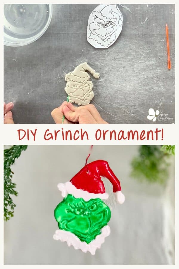 clay diy grinch ornament hanging from christmas tree branch