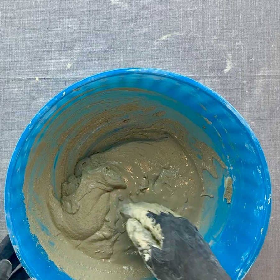cement in bowl after being mixed, shou=wing goopy consistency