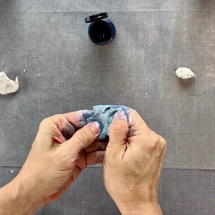 kneading blue clay