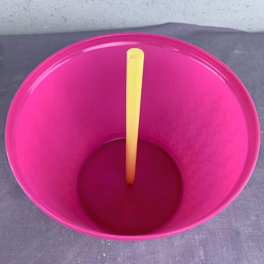 straw protruding from bottom of bowl