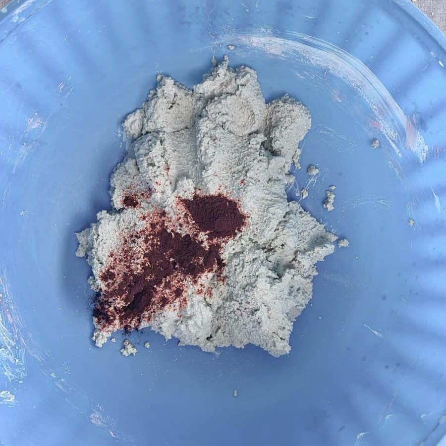 white mortar mix with powdered dye on top