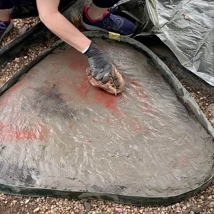 pressing plastic bag onto wet concrete while it begins to set