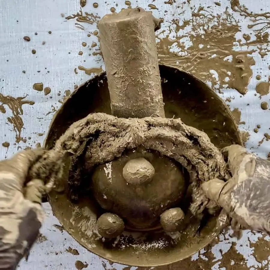 gnome with hair laying in bowl