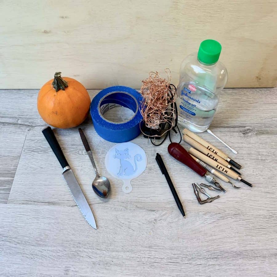 tools for carving a mini pumpkin of a cat