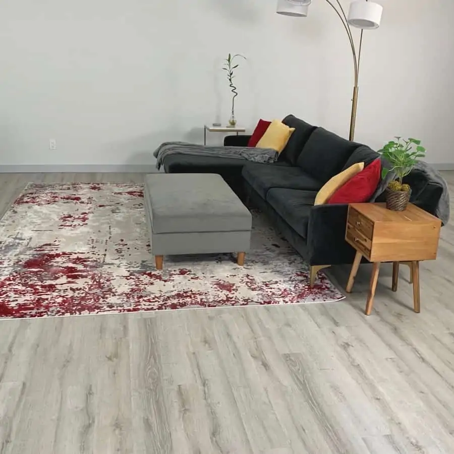 modern living room with leveled concrete floor underneath vinyl plant flooring