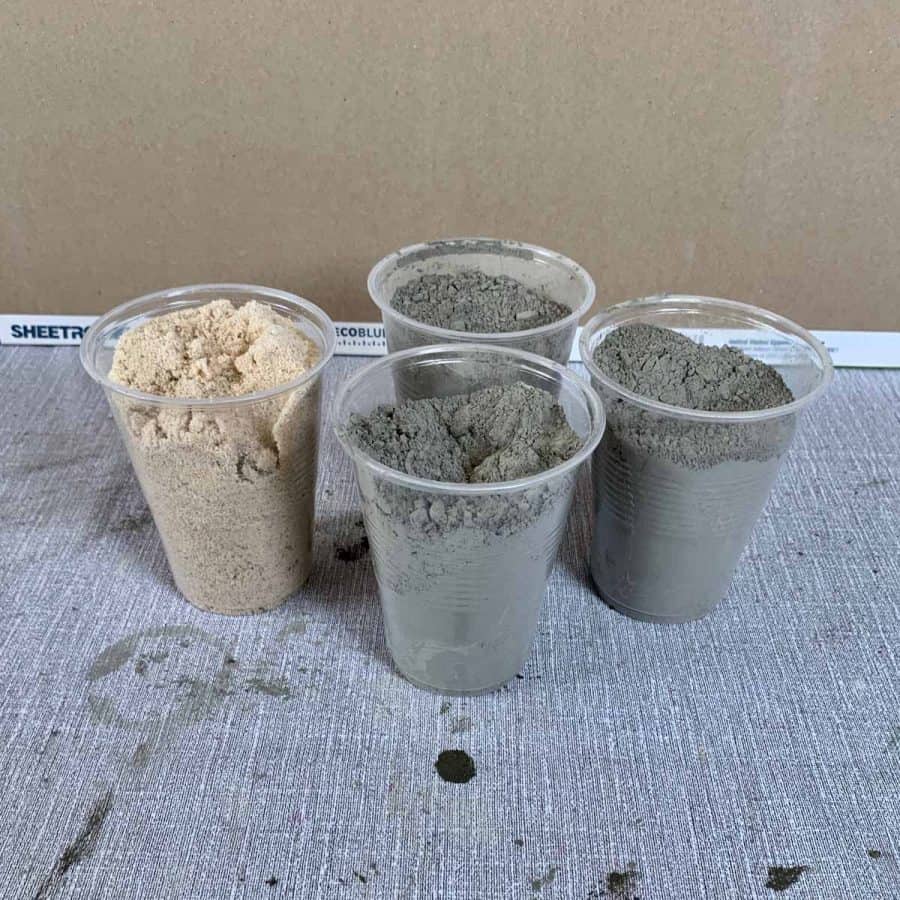 plastic cups measuring 3 parts cement and one part sand
