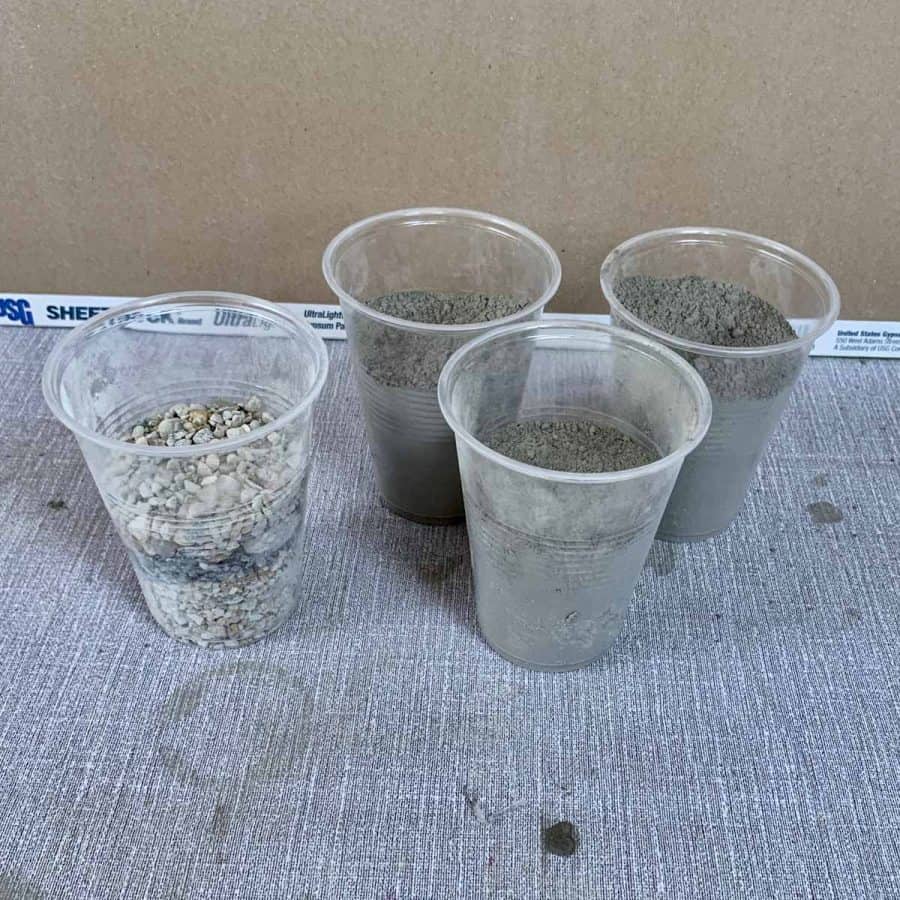 plastic cups measuring 3 parts cement and 1 part gravel