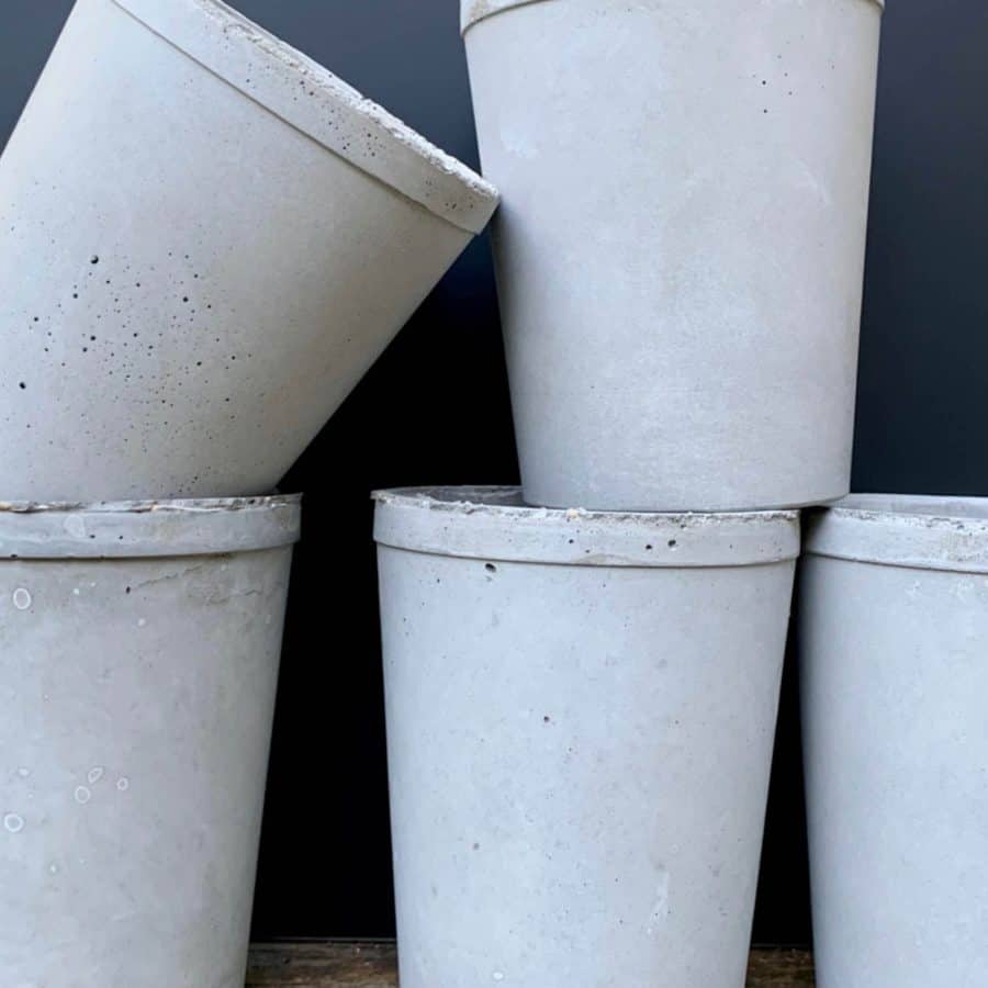 5 concrete vessels made with 5 different mixing ratios of portland cement to sand and gravel