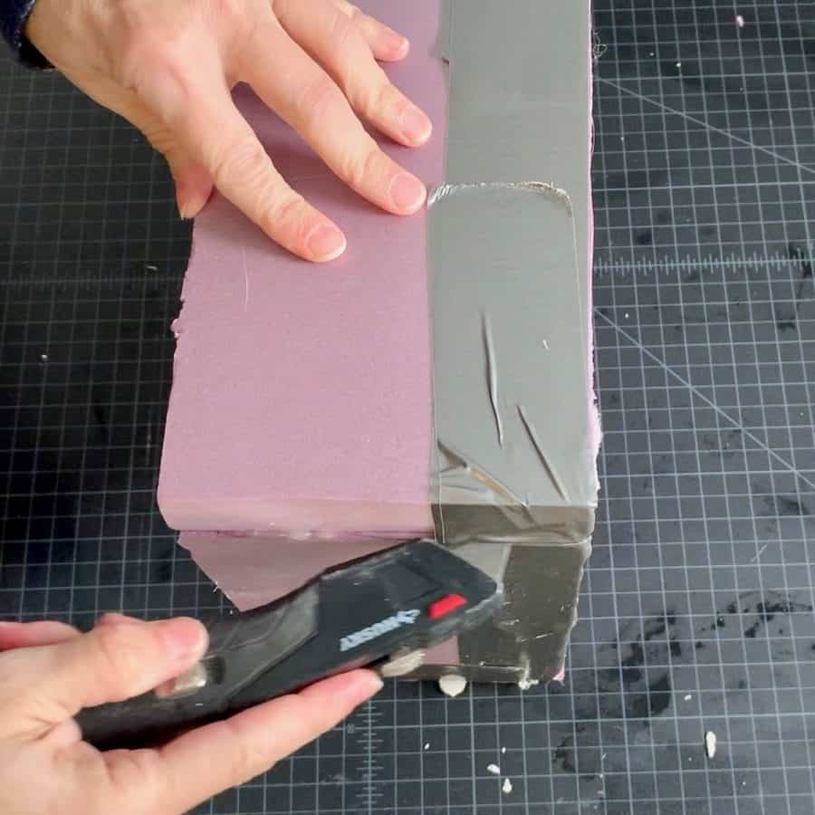 utility knife cutting taped seams of box