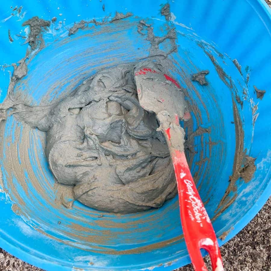 wet mortar mix in a bowl looks the consistency of brownie batter