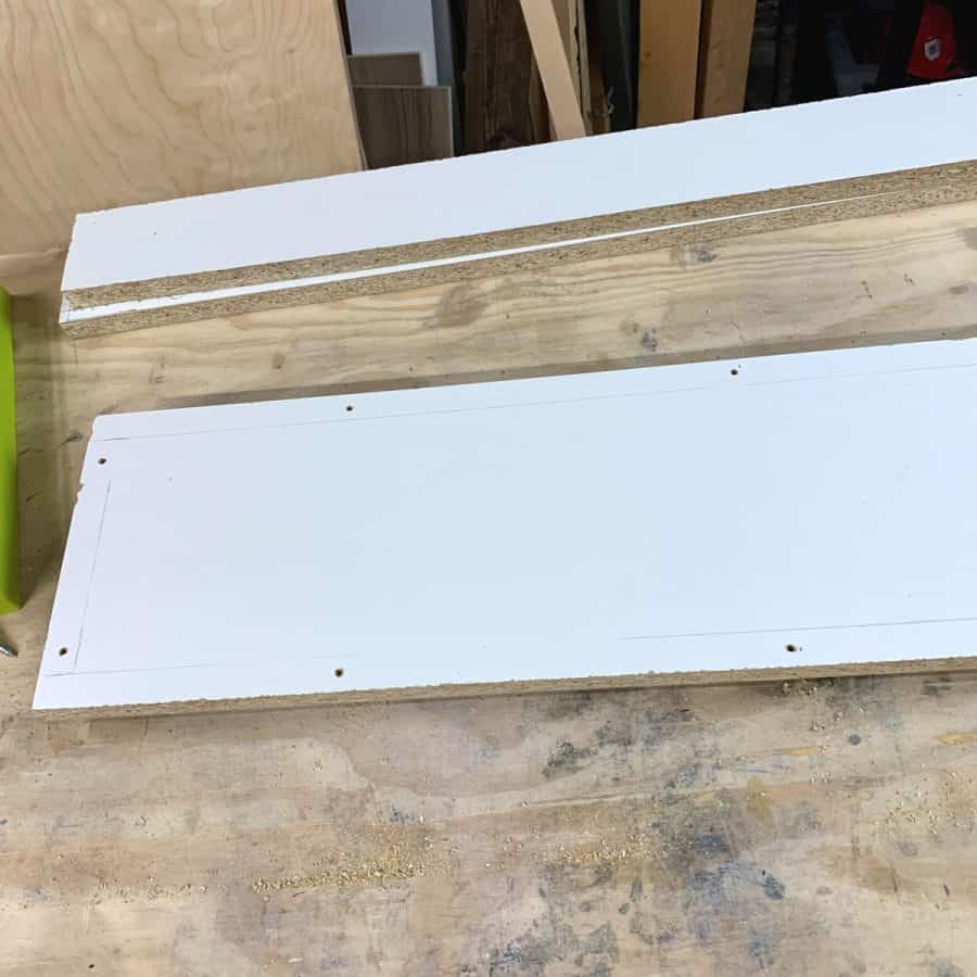 melamine board base with holes drilled around edges