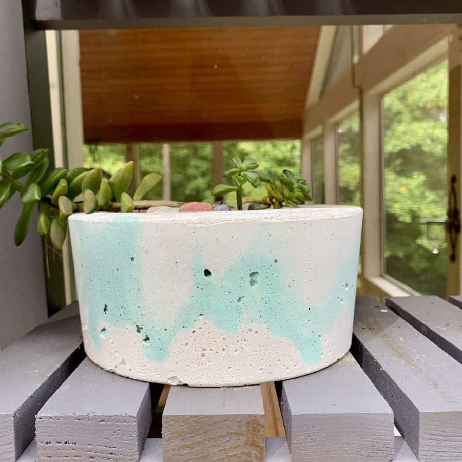 bowl shaped planter with green concrete colorant and white marbling