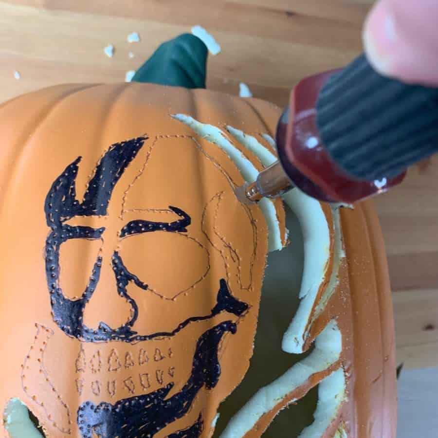 hot knife cutting lines to carve a foam pumpkin
