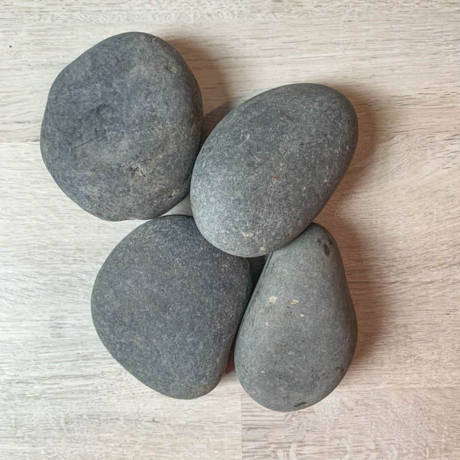 4 rocks of various shapes, in a pile 