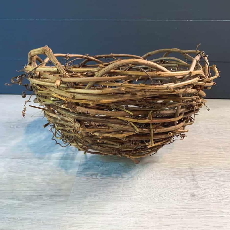 a finished image of the grapevine basket planter including spokes tucked in.