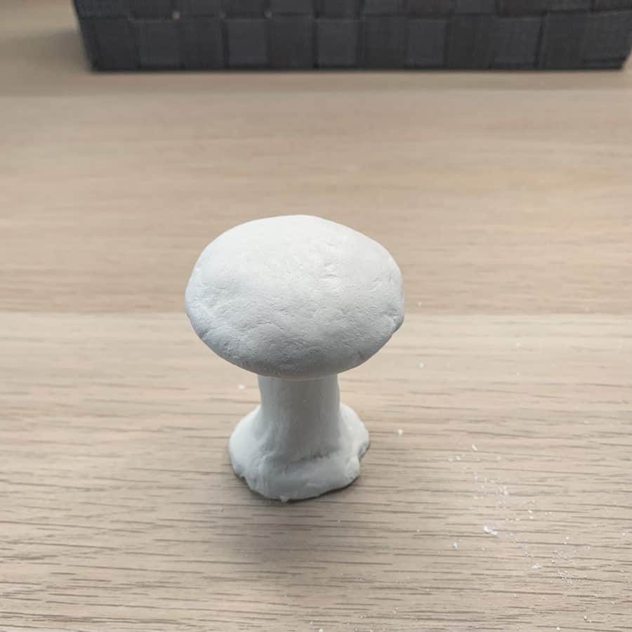 clay mushroom with rough areas now smoothed.