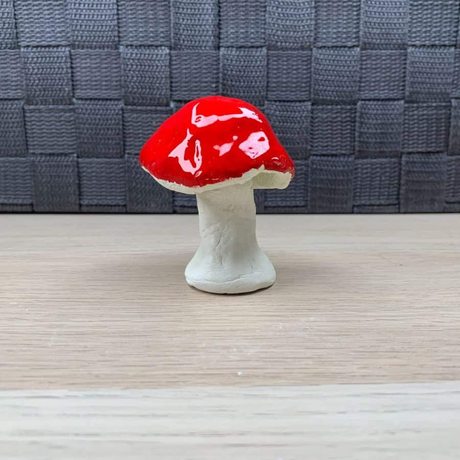 shiny red clay mushroom, looks like it's covered in gelatin
