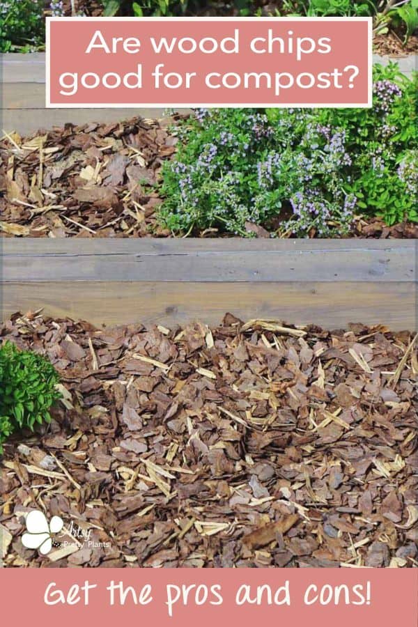 A tiered garden with plants and flowers growing between layers of composted wood chips.