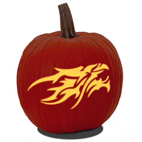 A carved pumpkin made from a free PDF dragon pumpkin carving stencil.