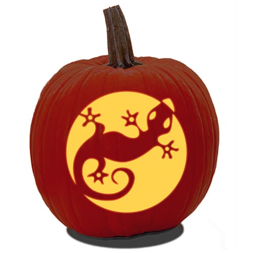 A Jack O' Lantern made from a free Dragon pumpkin carving stencil PDF.