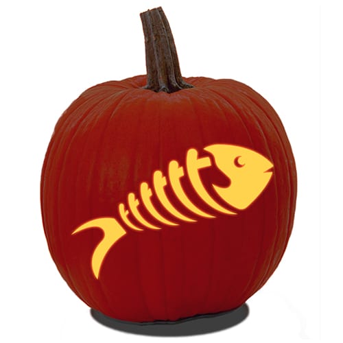 A carved pumpkin with a skeleton of a fish design from printable fish pumpkin carving pattern.