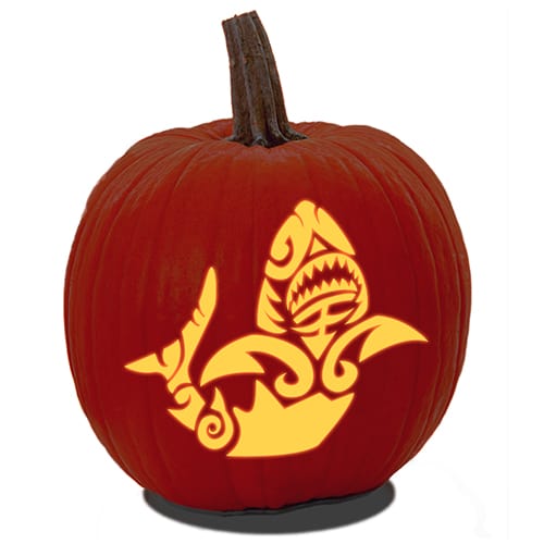 A carved pumpkin of a shark with tattoo shapes design from PDF fish pumpkin carving stencil.