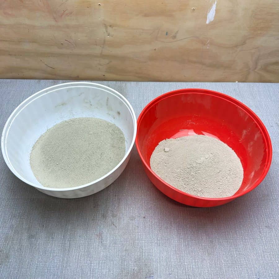 Two bowls of cement, one has more mix in it than the other.