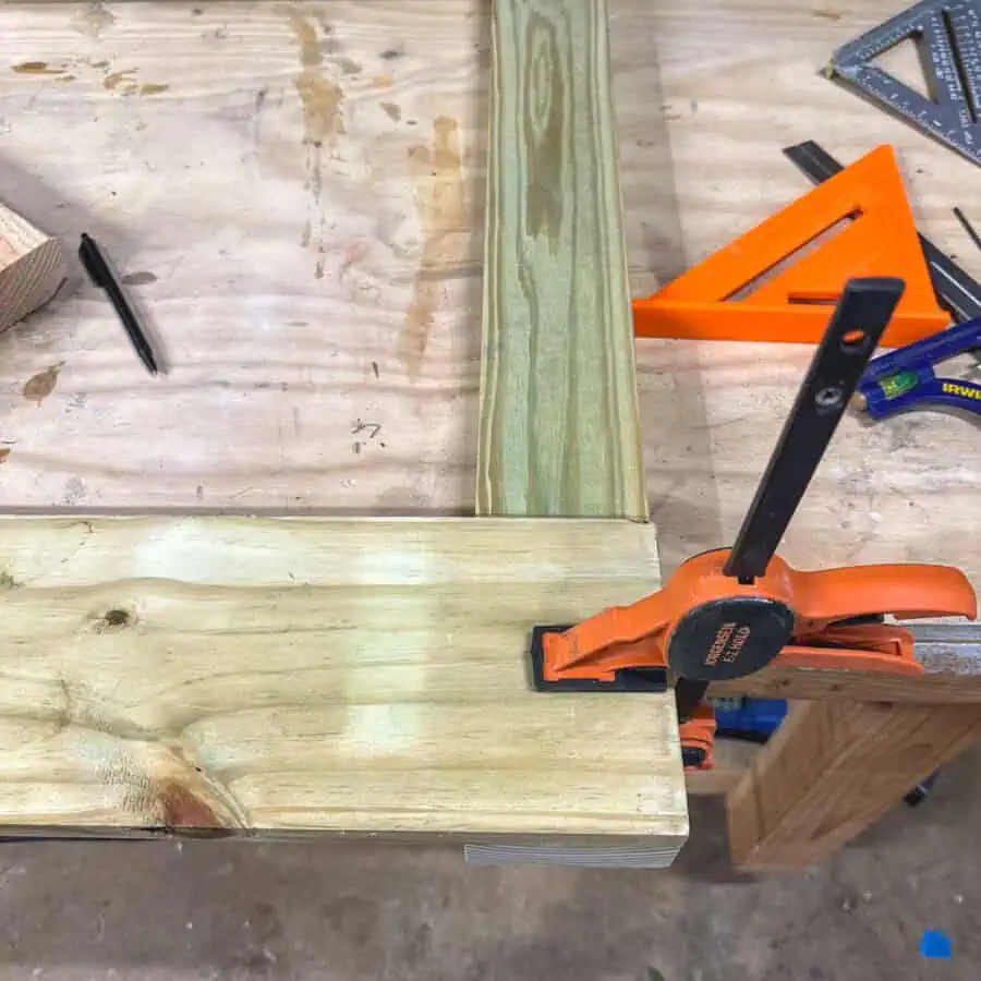 Clamps holding two boards together.