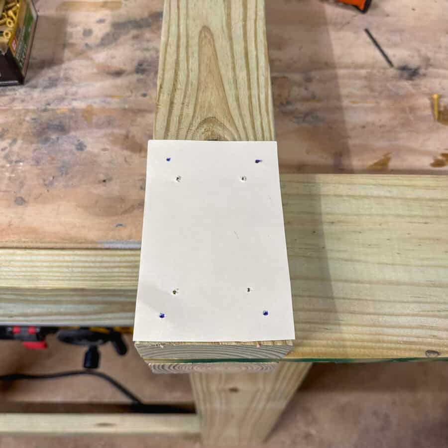 Card stock with 8 holes indicating where drill holes will go.