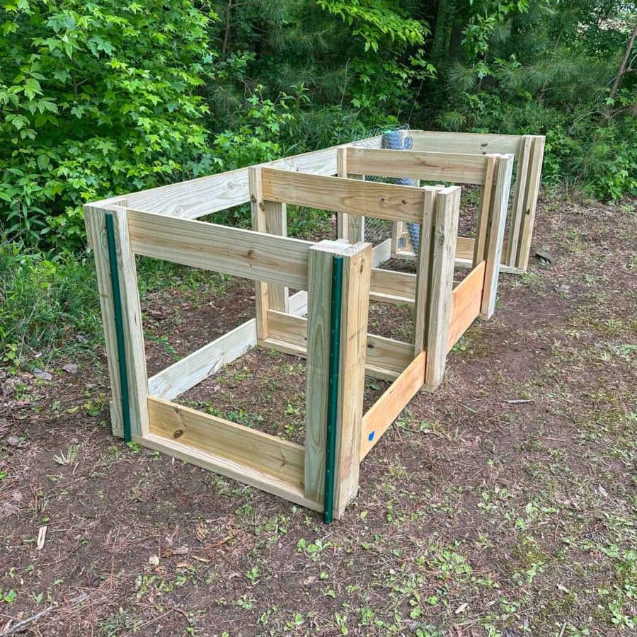 Bins secured to ground with yard posts.