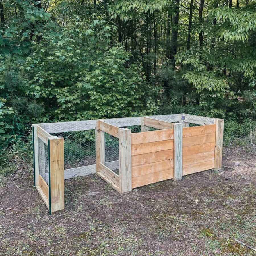 Finished pic of 3 unit compost bins with front panels removed from one unit.